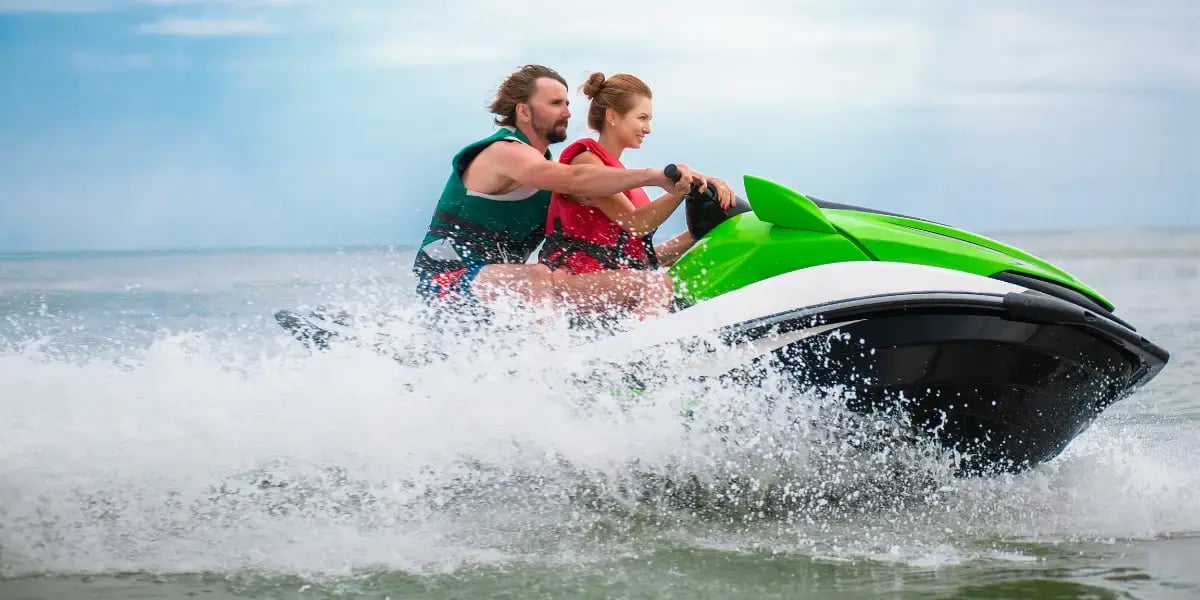 couple having fun on water scooter summer sea activity
