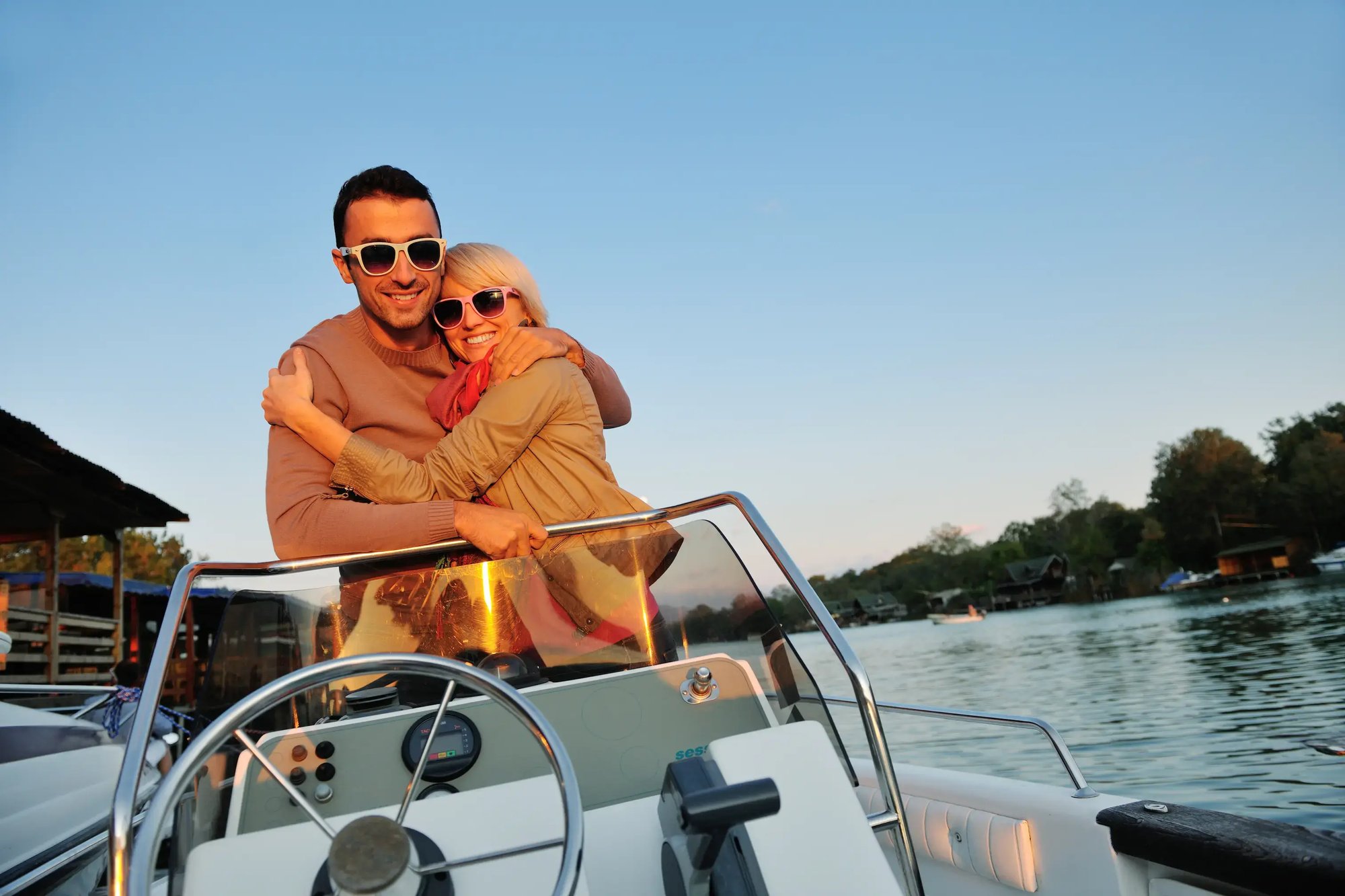(Licenced) affectionate-couple-embracing-on-a-motorboat-ride-2026-04-14-00-51-35-utc