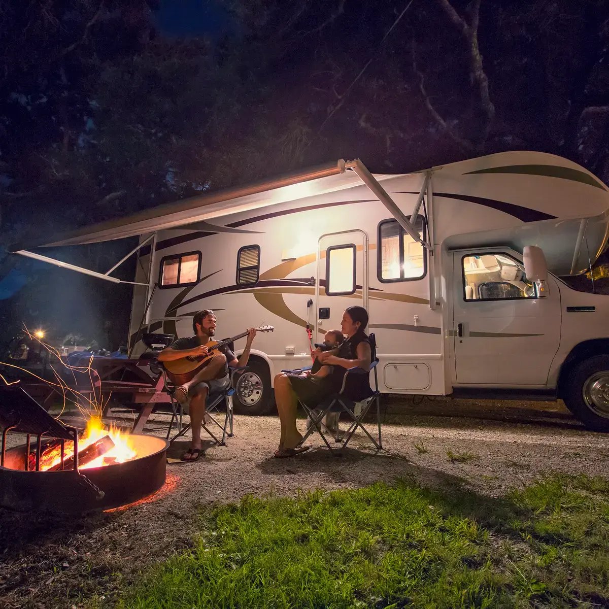 family camping trip with music and campfire